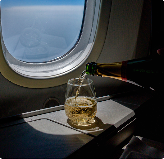 Drink next to an aeroplane window